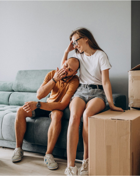 Couples unpacking boxes in their new home